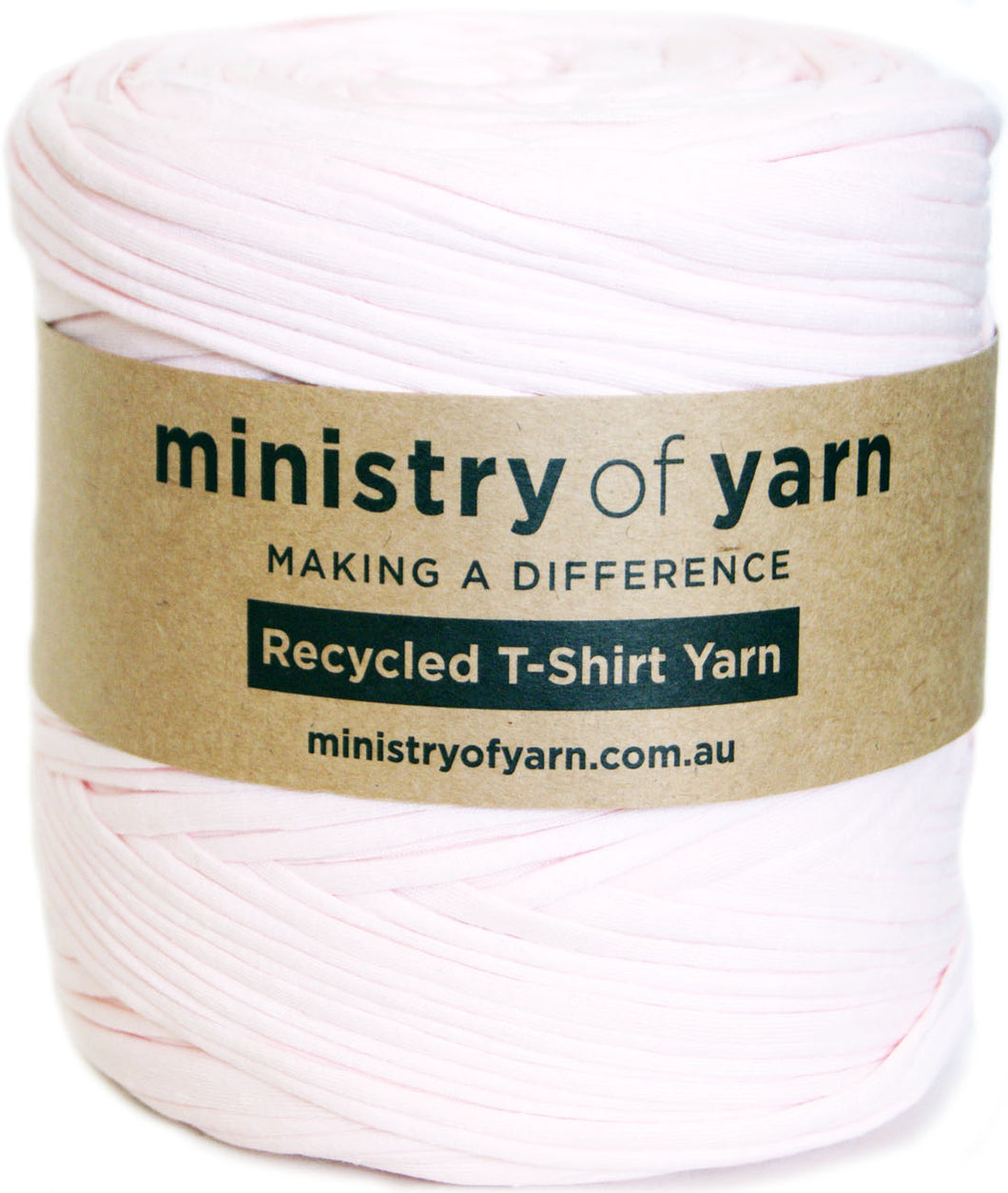 A spool of pale pink recycled T-shirt yarn wrapped with a brown paper label that reads 'ministry of yarn' and 'Recycled T-Shirt Yarn'.