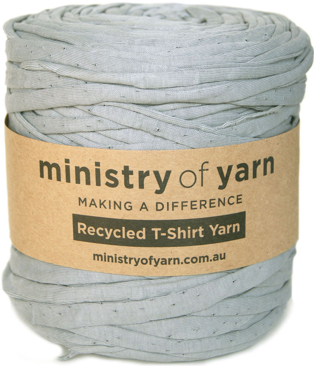 A spool of light gray recycled T-shirt yarn wrapped in a brown kraft paper label that reads 'ministry of yarn'.