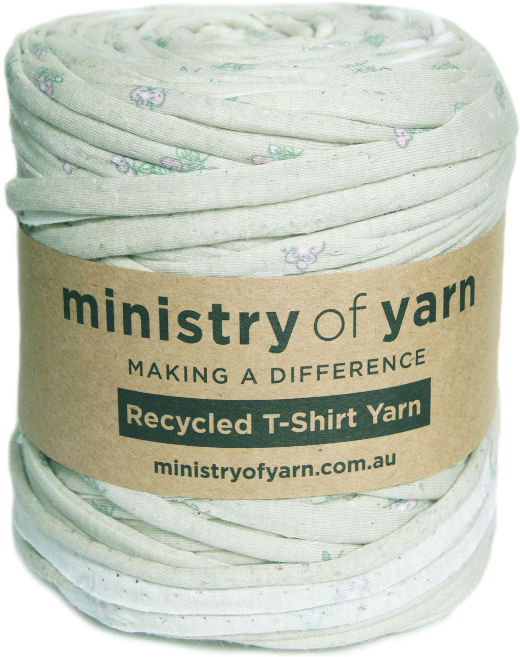 A roll of Ministry of Yarn recycled T-shirt yarn in a pale sage green color with a small floral print, wrapped in a brown paper label.