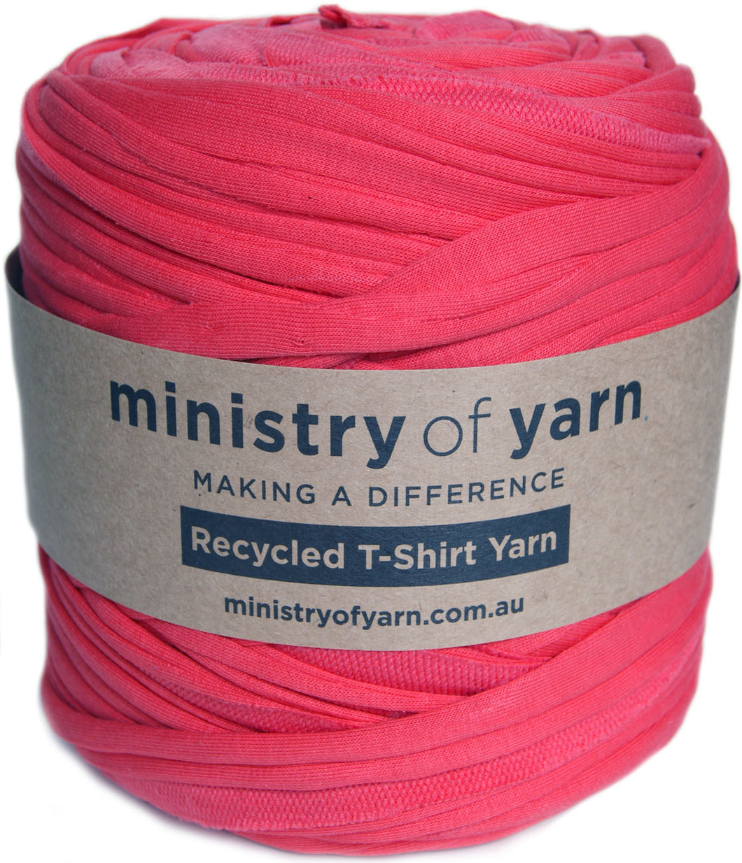A large spool of bright pink recycled T-shirt yarn wrapped with a brown paper label that reads 'ministry of yarn'.