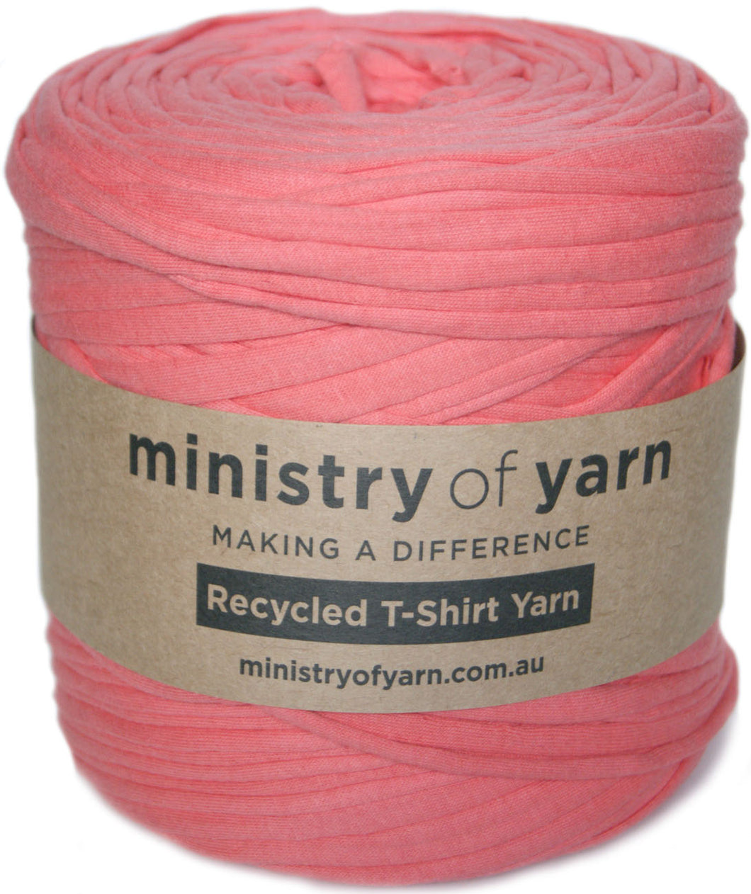 A skein of coral pink recycled T-shirt yarn wrapped in a brown kraft paper label that reads 'ministry of yarn'.