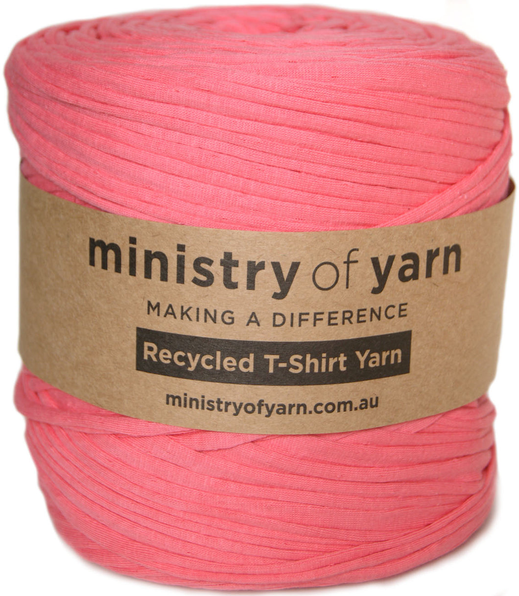 A skein of pink recycled T-shirt yarn wrapped in a brown paper label that reads 'ministry of yarn' and 'Recycled T-Shirt Yarn'.