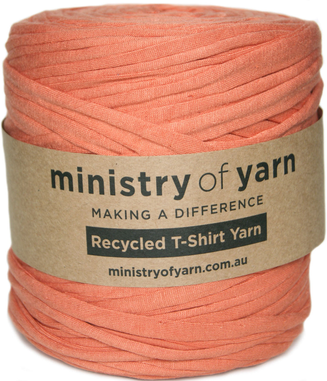 A ball of peach-colored recycled T-shirt yarn wrapped in a brown kraft paper label that reads 'ministry of yarn'.