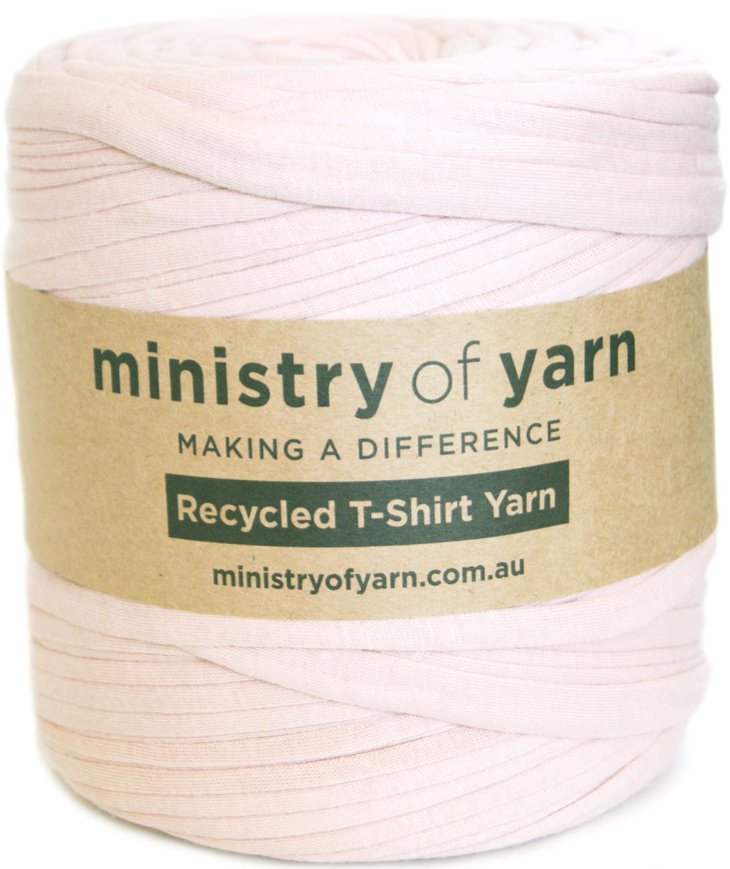 A spool of pale pink recycled T-shirt yarn wrapped with a brown paper label that reads 'ministry of yarn' and 'Recycled T-Shirt Yarn'.