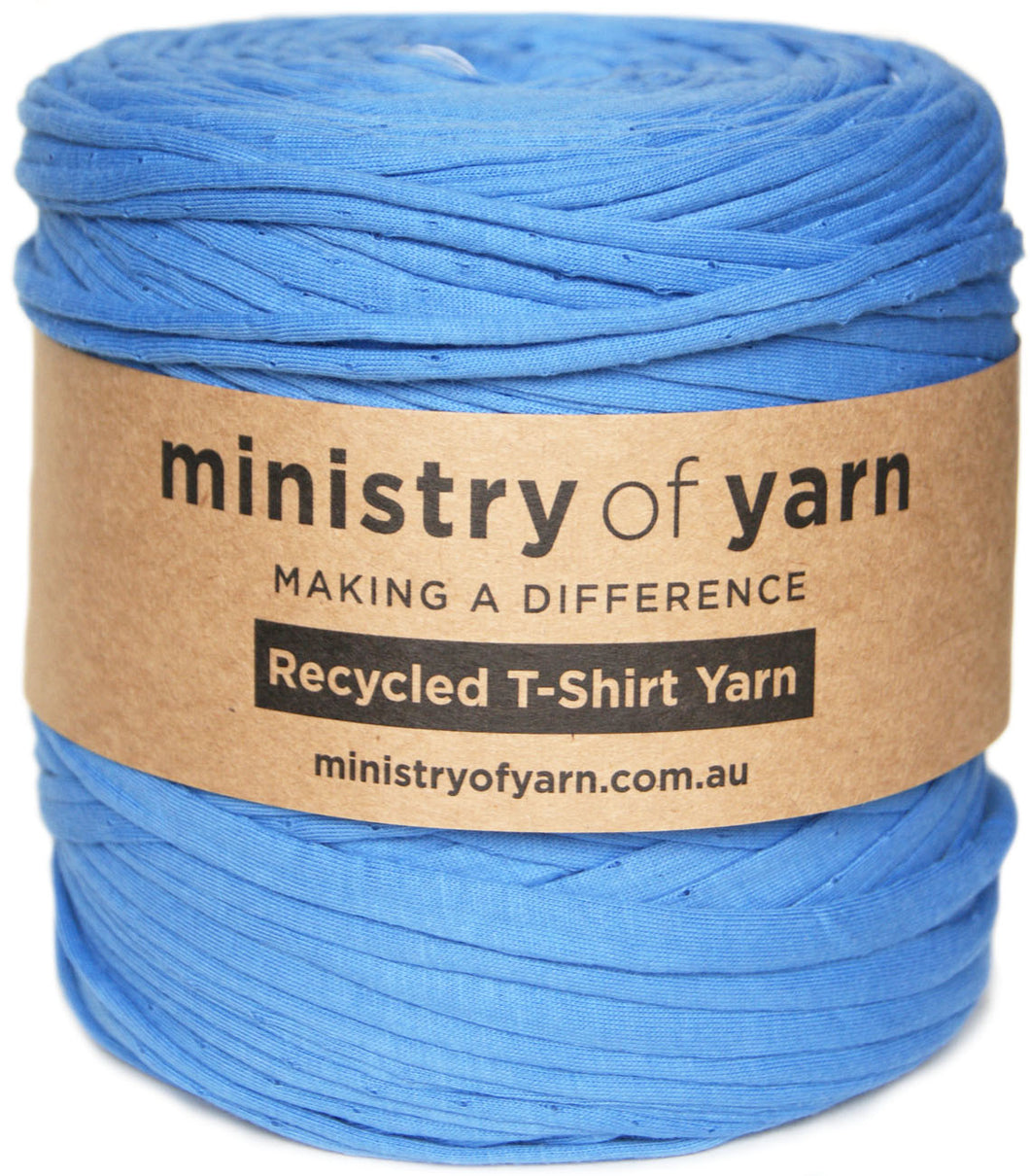 A skein of blue recycled T-shirt yarn wrapped in a brown paper label that reads 'ministry of yarn' and 'Recycled T-Shirt Yarn'.