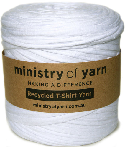A roll of white recycled T-shirt yarn wrapped with a brown paper label that reads 'ministry of yarn' and 'Recycled T-Shirt Yarn'.