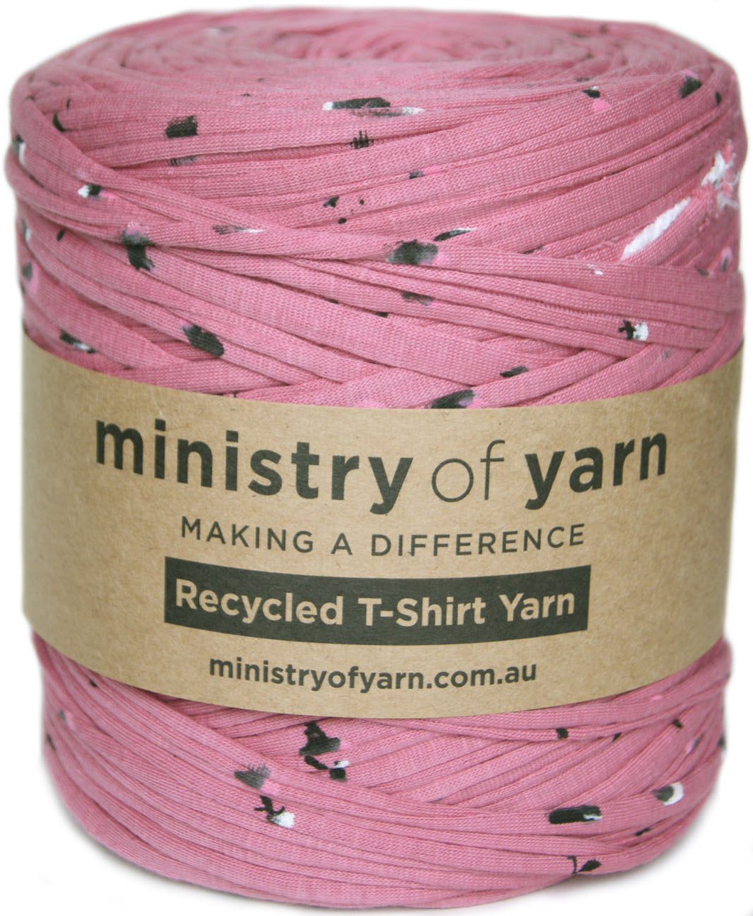 A spool of pink recycled T-shirt yarn with black and white speckles, wrapped in a brown paper label that reads 'ministry of yarn'.