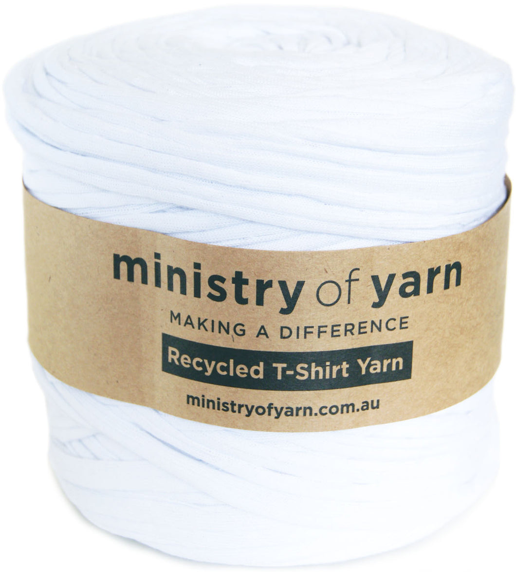 A spool of white recycled T-shirt yarn wrapped with a brown paper label that reads 'ministry of yarn' and 'Recycled T-Shirt Yarn'.