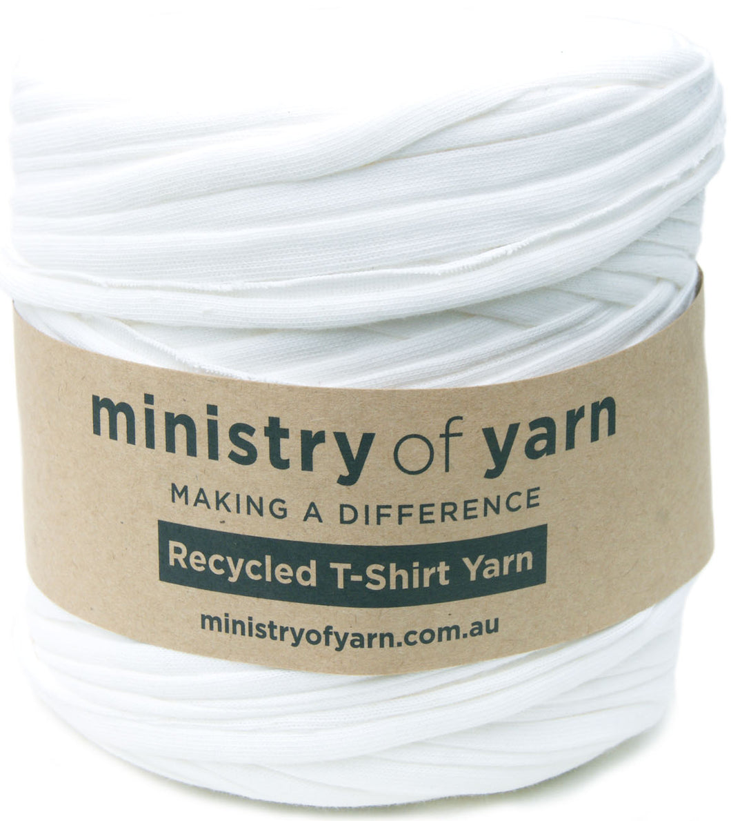 A spool of white recycled T-shirt yarn wrapped with a brown paper label that reads 'ministry of yarn' and 'Recycled T-Shirt Yarn'.