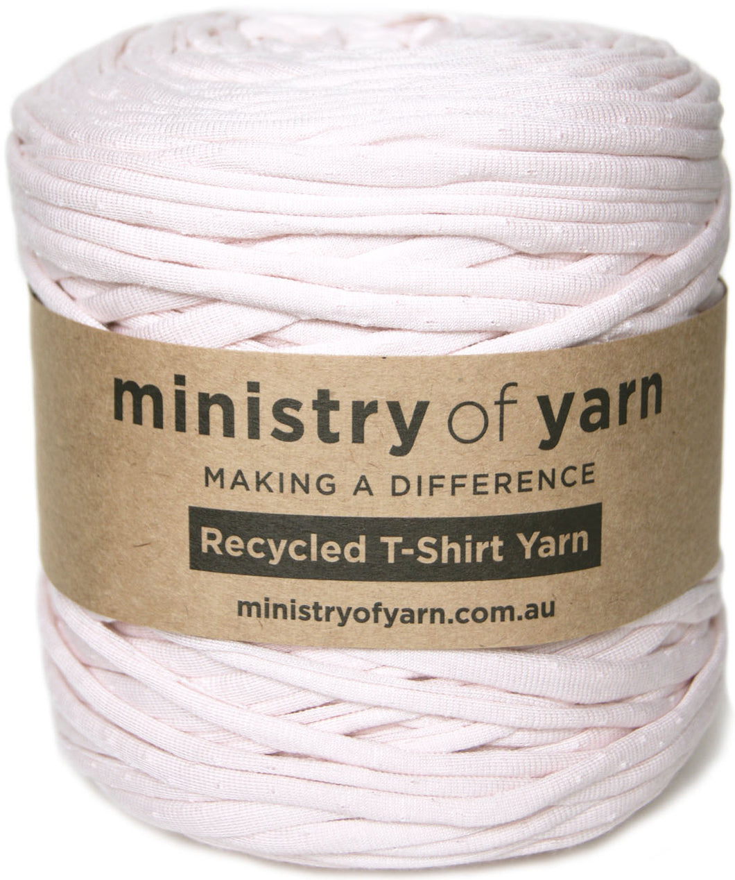 A spool of pale pink recycled t-shirt yarn wrapped with a brown paper label that reads 'ministry of yarn'.