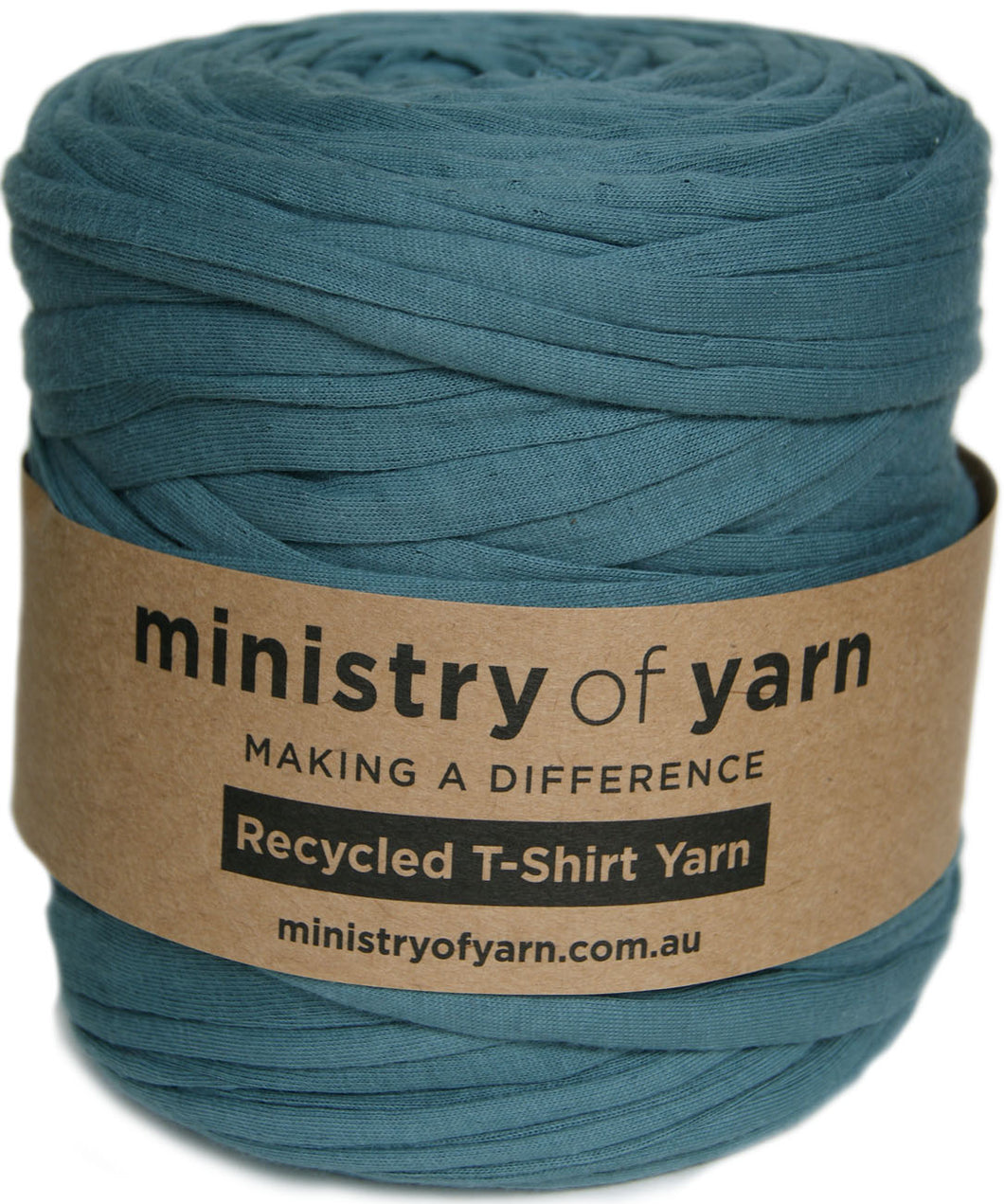 A large spool of dusty teal blue recycled T-shirt yarn wrapped with a brown kraft paper label that reads 'ministry of yarn'.