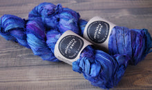 Deep blue sari silk ribbon yarn with purple accents