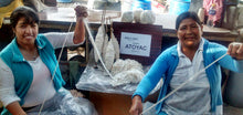 Peruvian yarn artisans demonstrating traditional hand spinning